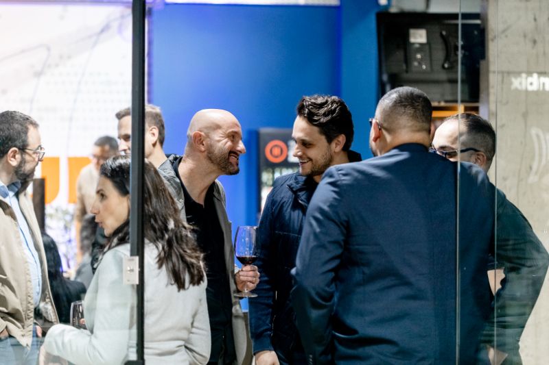 Team engaged in microlearning training session on digital devices in modern office